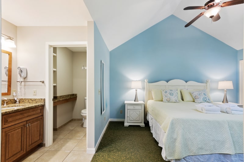 A bedroom & bathroom at Spicebush at Sea Pines on Hilton Head Island, SC.